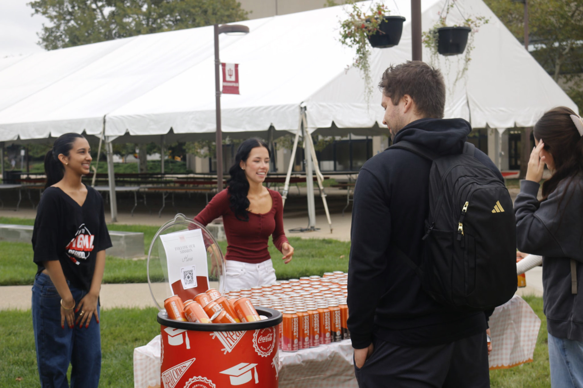 Members talking with students at the Pad the Policy pop-up